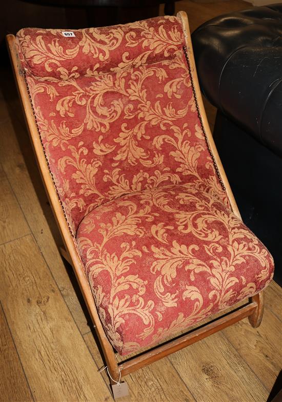 An Edwardian beech folding nursing chair